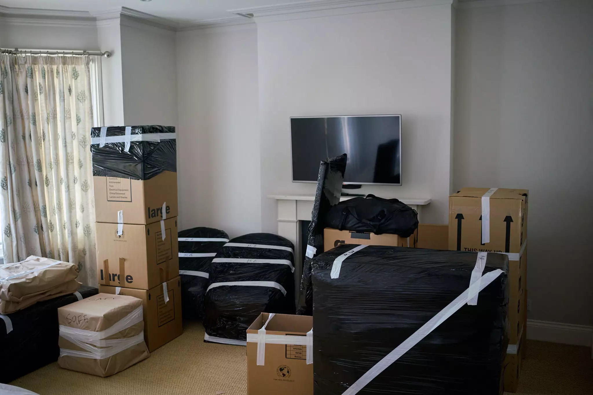 Carefully packed and wrapped furniture ready for loading during a move