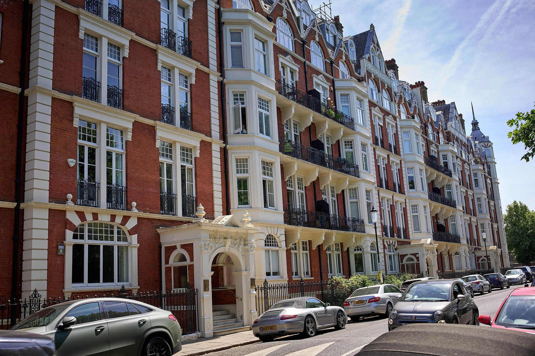 Red-brick Victorian mansion flats on London street