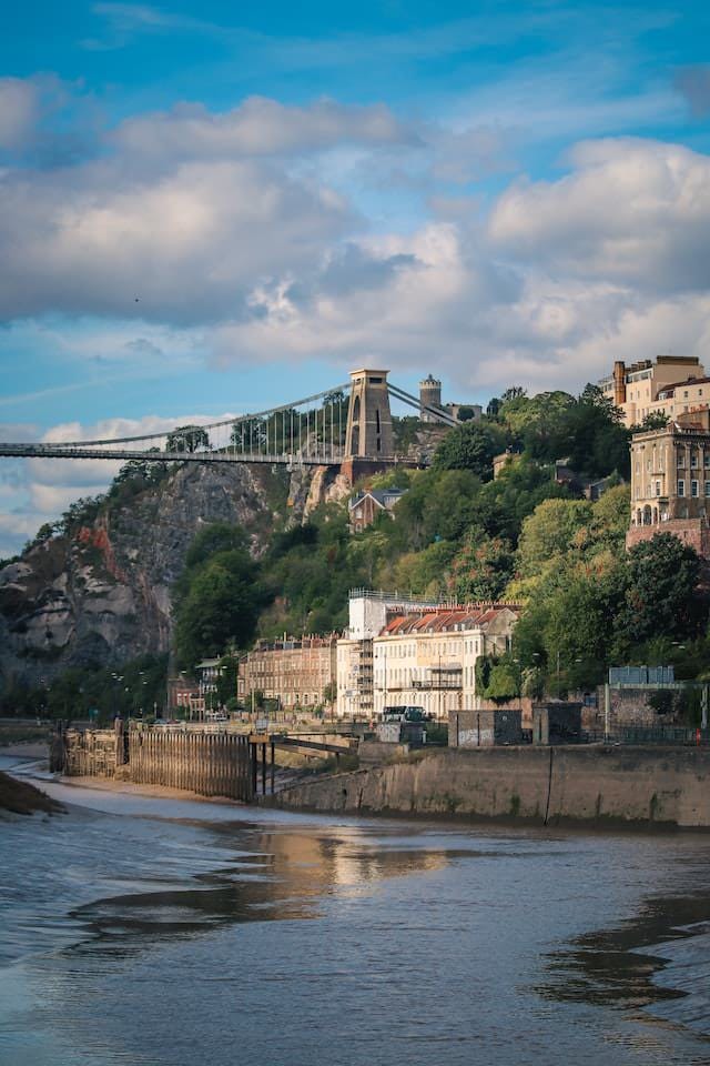 Clifton Suspension Bridge and riverside houses in Bristol, UK.