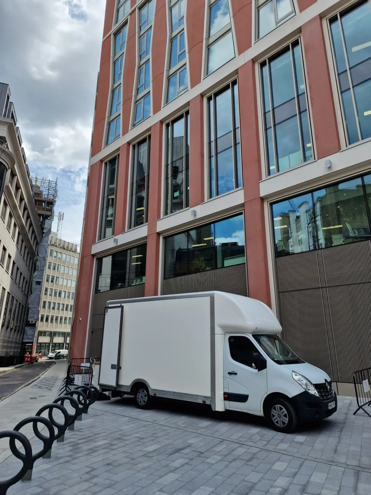 MaxiMover van parked beside modern office building