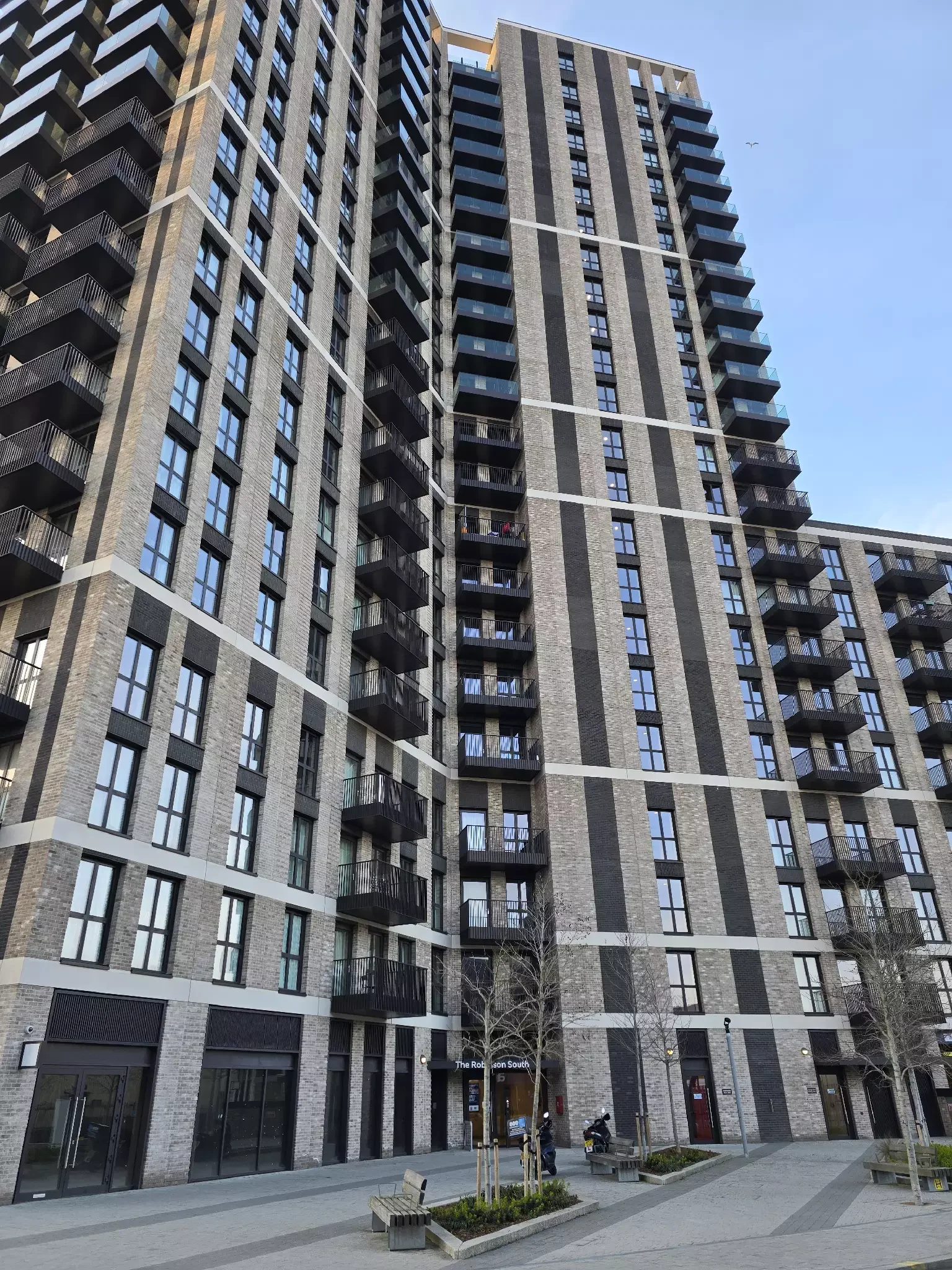 Modern high-rise apartment building with balconies