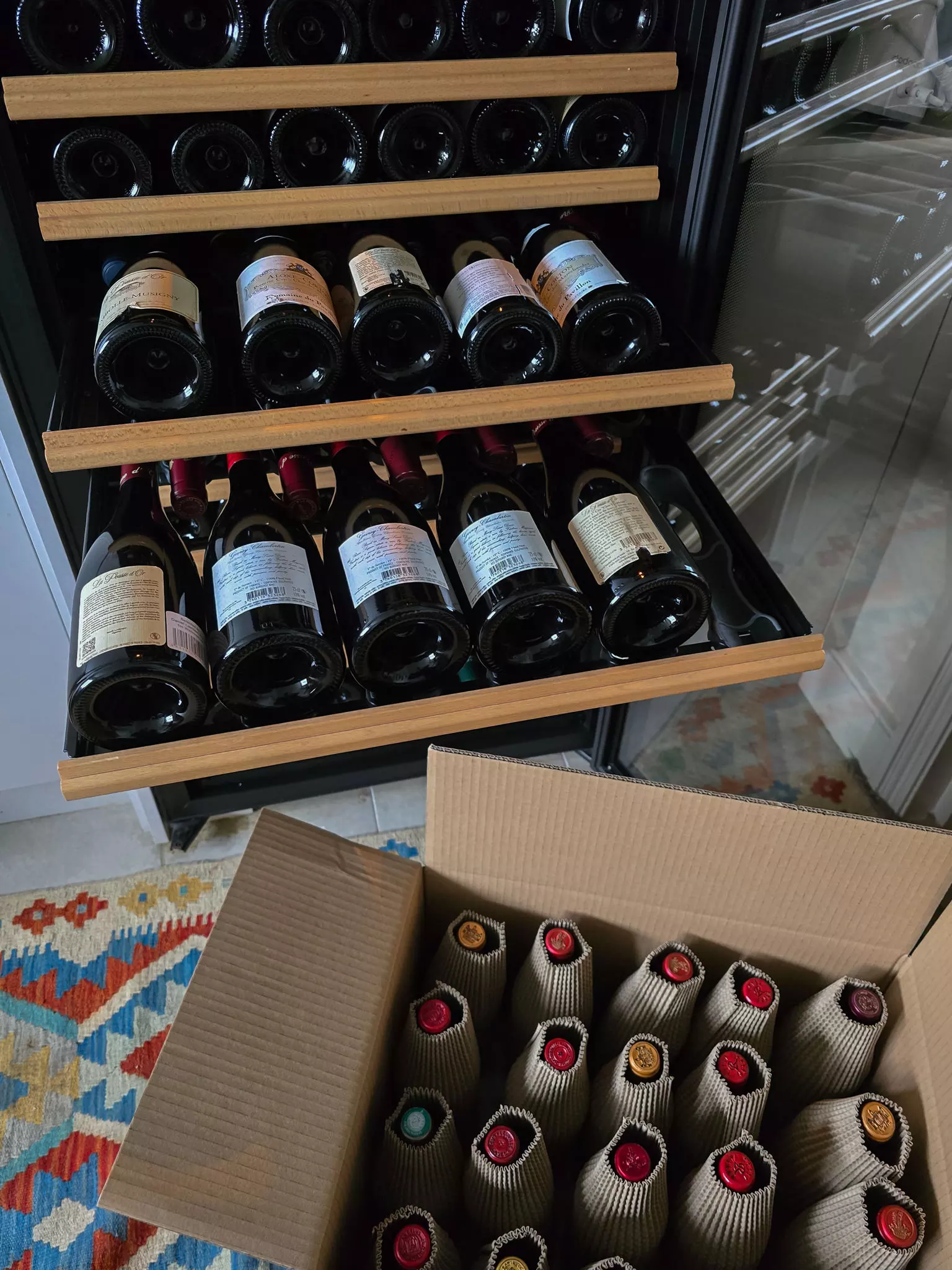Wine bottles being packed securely for a house move using protective packaging by Best London Removals.