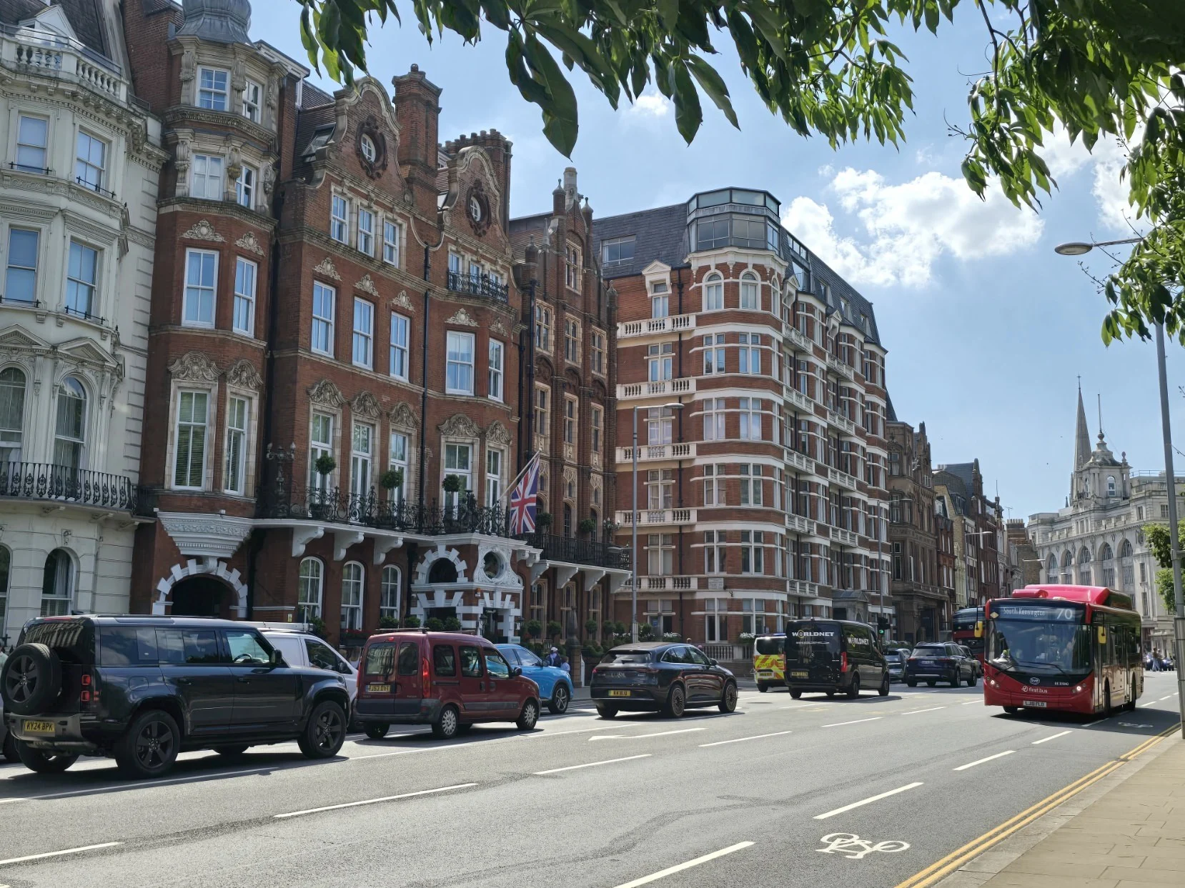 London street with red brick buildings and bus