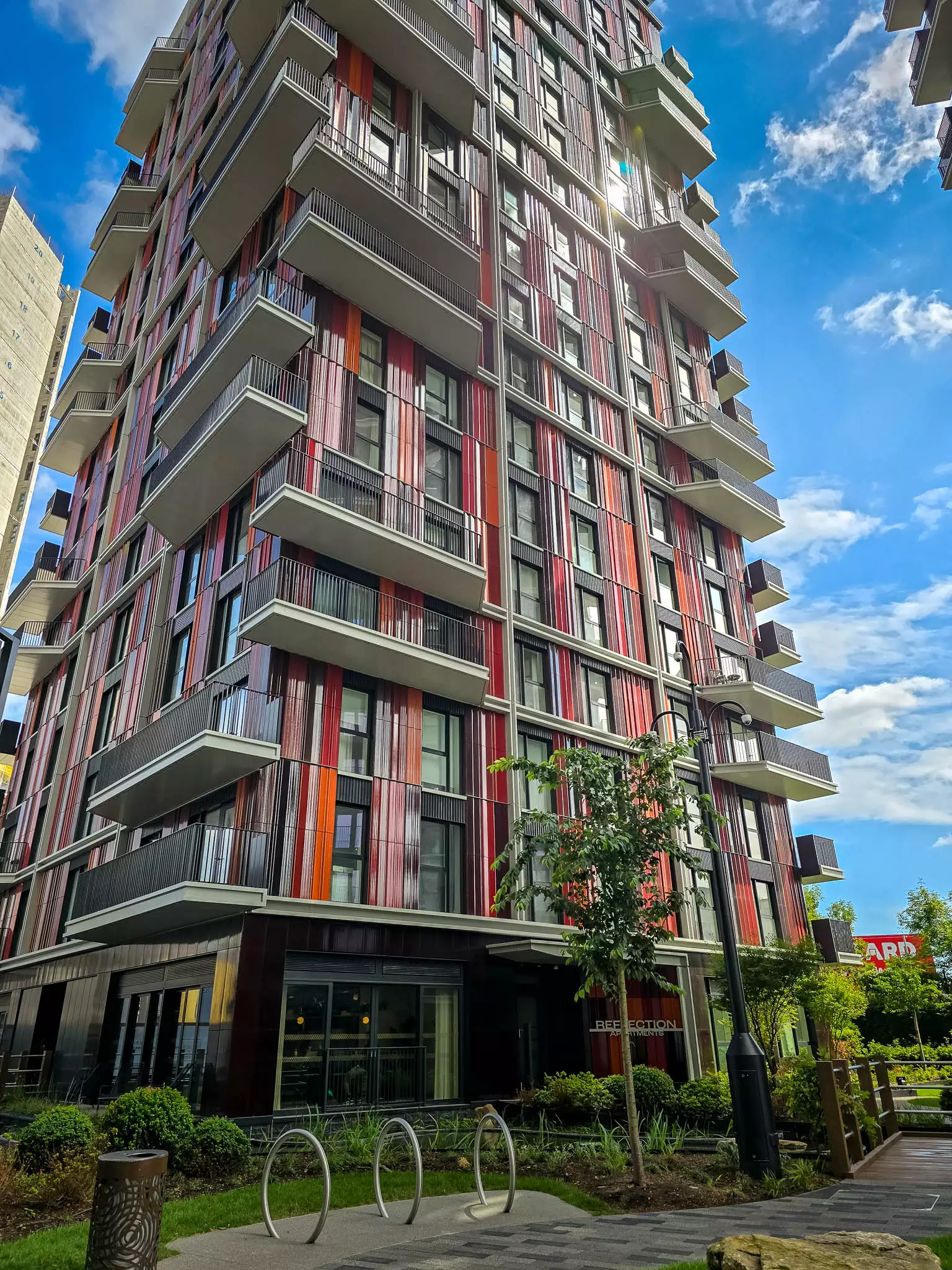 Exterior view of Reflection Residences, a modern high-rise apartment building in London