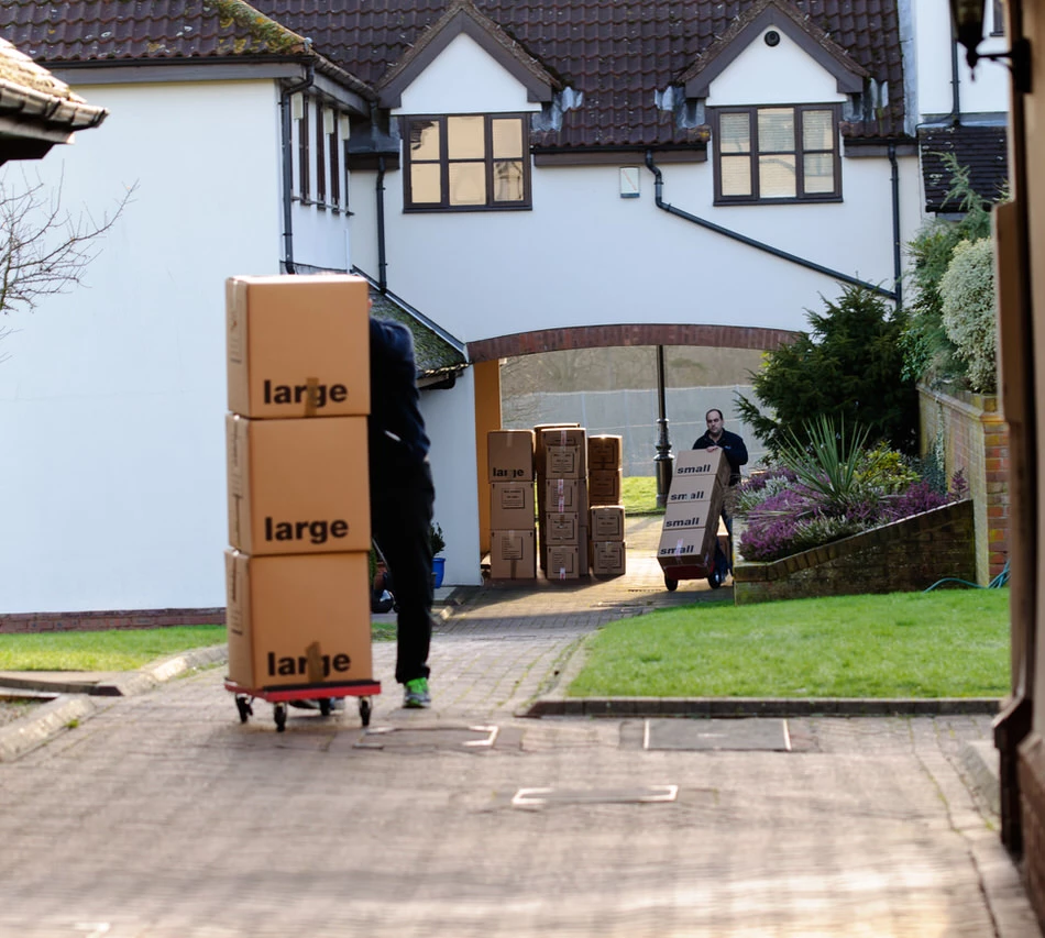 moving house Harrow - man pushing moving troley