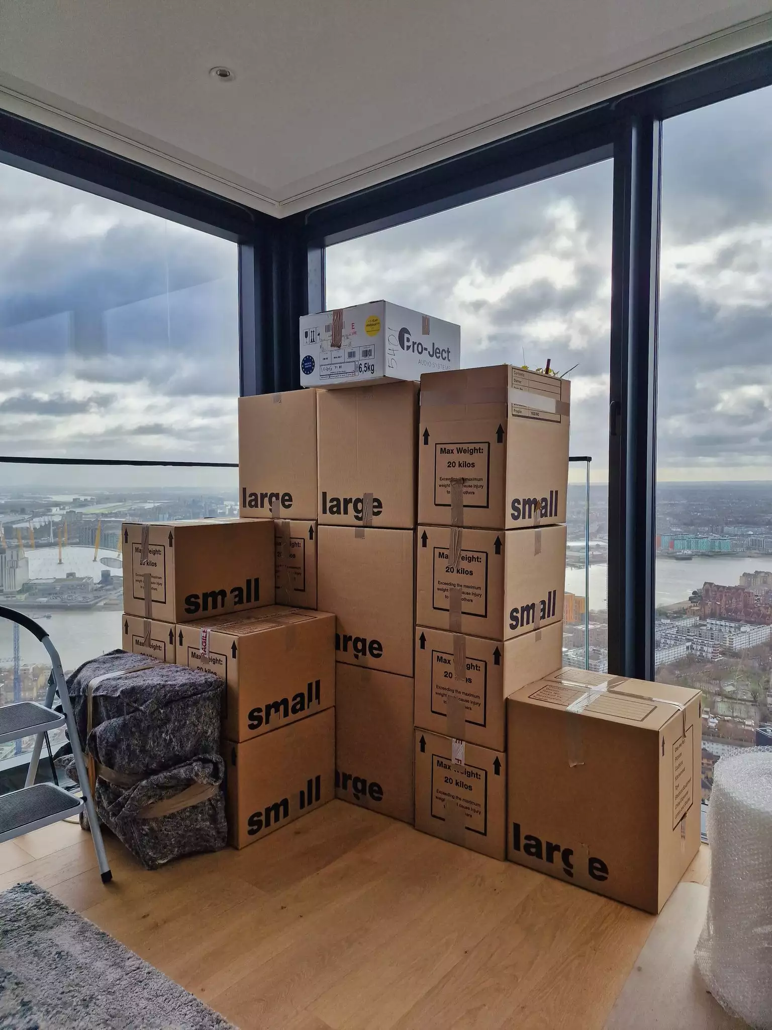 Fully packed city apartment with a skyline view, prepared for professional removal.