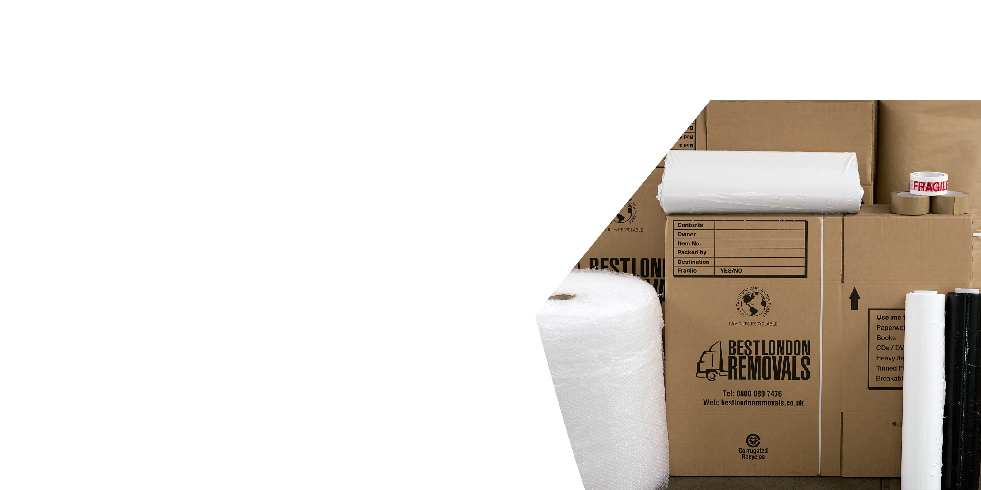 Cardboard boxes, kraft paper roll, black stretch film, and bubble wrap for home removals