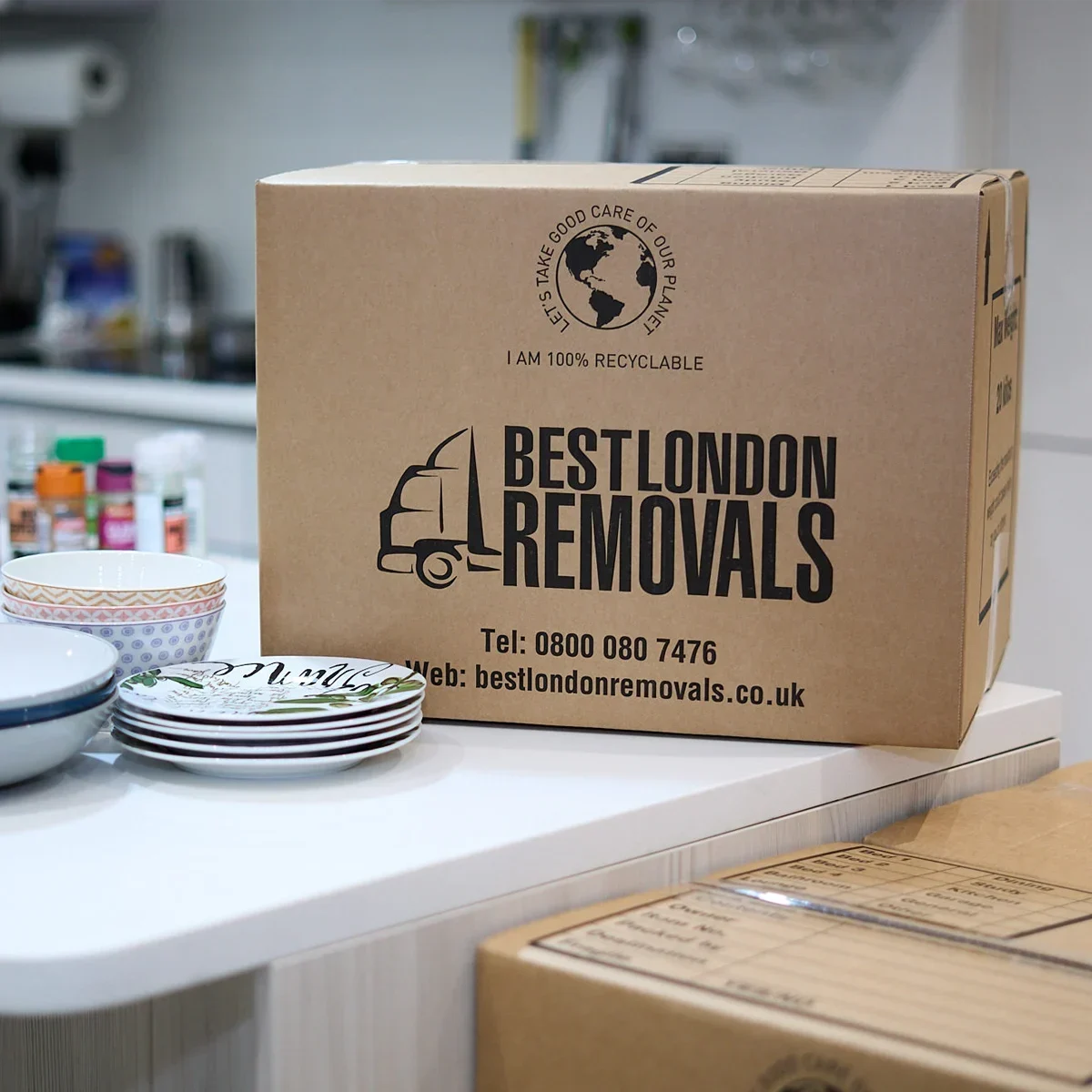 Small moving box on top of kitchen worktop - fragile packing