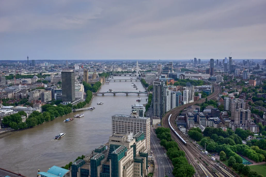 Aerial view along the River Thames from Vauxhall towards Westminster and the London Eye